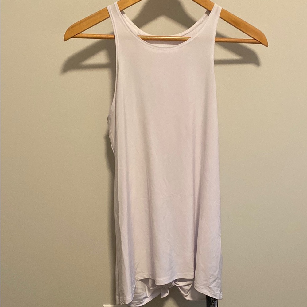 Onzie White One size open back Tank top. With tie bottom.